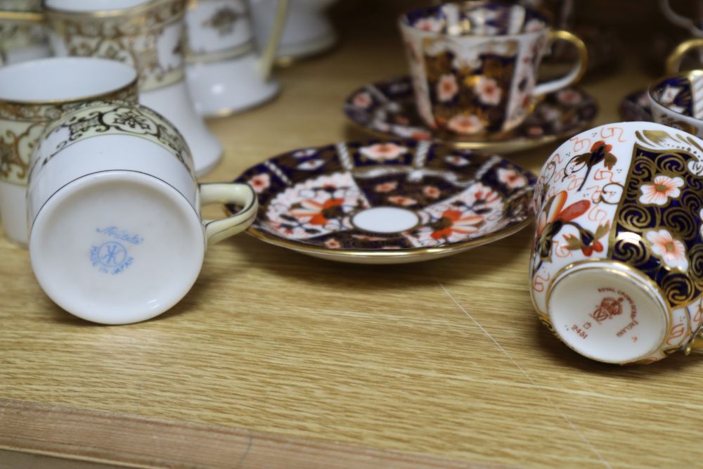 A set of six Royal Crown Derby miniature tea cups and saucers, date codes 1920s and a Noritake fifteen piece coffee service